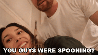 A Man And A Woman Are Smiling With The Words " You Guys Were Spooning " Below Them GIF