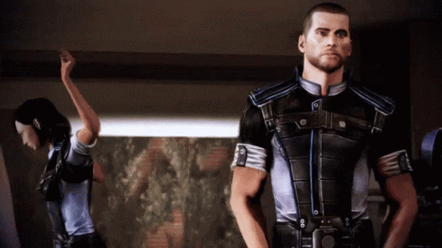 A Man And A Woman Are Standing In A Room GIF