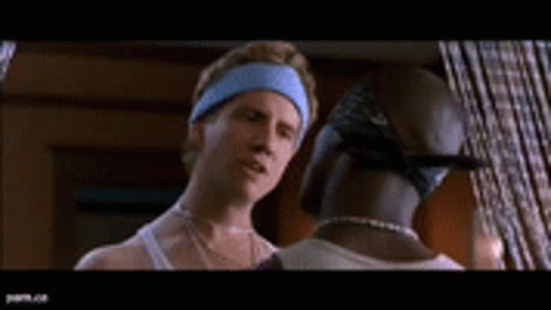 A Man And A Woman Are Standing In A Room Talking To Each Other GIF
