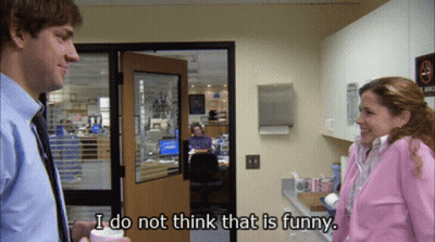 A Man And A Woman Are Standing In An Office And The Woman Says I Do Not Think That Is Funny GIF