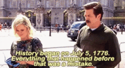 A Man And A Woman Are Standing In Front Of A Building That Says History Began On July 5 1776 . GIF