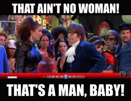 A Man And A Woman Are Standing In Front Of A Crowd With The Caption That Ain 'T No Woman GIF