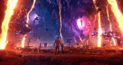 A Man And A Woman Are Standing In Front Of A Purple And Orange Fire GIF