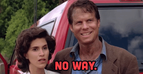 A Man And A Woman Are Standing In Front Of A Red Suv And The Man Says No Way GIF