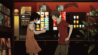 A Man And A Woman Are Standing In Front Of A Vending Machine That Has A Coca Cola Sign On It GIF