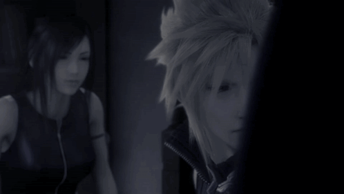A Man And A Woman Are Standing Next To Each Other GIF