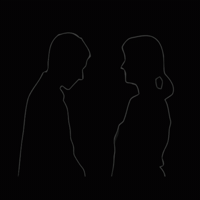 A Man And A Woman Are Standing Next To Each Other And Looking At Each Other . GIF