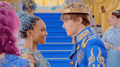 A Man And A Woman Are Standing Next To Each Other And Looking At Each Other In A Castle . GIF