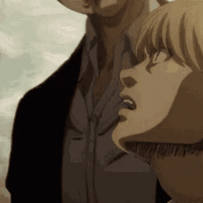 A Man And A Woman Are Standing Next To Each Other And Looking At The Sky . GIF