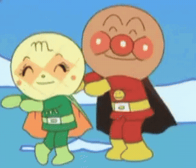 A Man And A Woman Are Standing Next To Each Other And One Has The Letter M On Her Face GIF