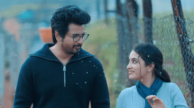 A Man And A Woman Are Standing Next To Each Other And Smiling GIF