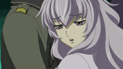 A Man And A Woman Are Standing Next To Each Other And The Man Has A Gold Badge On His Chest GIF
