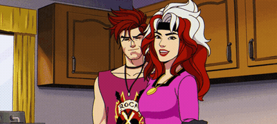 A Man And A Woman Are Standing Next To Each Other And The Man Has A Shirt That Says Roca On It GIF