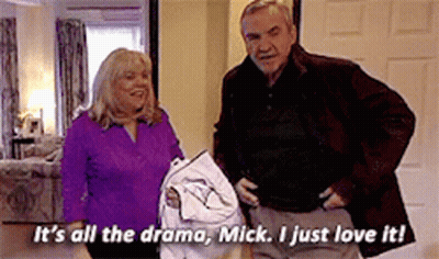 A Man And A Woman Are Standing Next To Each Other And The Man Is Saying It 'S All The Drama GIF