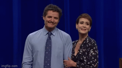 A Man And A Woman Are Standing Next To Each Other And The Man Is Saying No Crumbs Left GIF