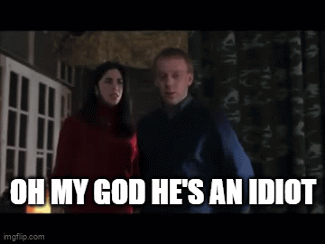 A Man And A Woman Are Standing Next To Each Other And The Man Is Saying " Oh My God He 'S An Idiot " GIF