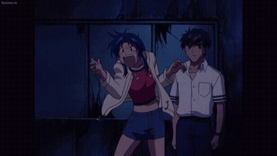 A Man And A Woman Are Standing Next To Each Other And The Man 'S Shirt Says Beanime.tv On It GIF