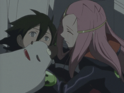 A Man And A Woman Are Standing Next To Each Other And The Woman Has Pink Hair GIF