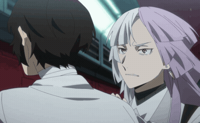 a man and a woman are standing next to each other and the woman has purple hair