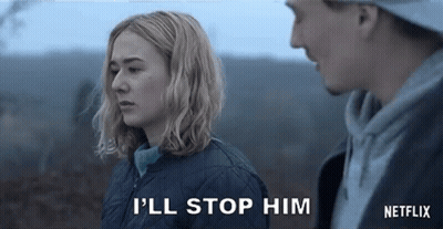 A Man And A Woman Are Standing Next To Each Other And The Woman Is Telling The Man To Stop . GIF