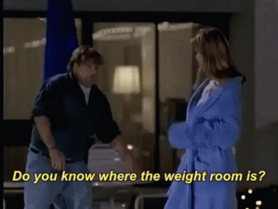 A Man And A Woman Are Standing Next To Each Other And The Woman Is Wearing A Blue Robe GIF