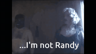 A Man And A Woman Are Standing Next To Each Other And The Woman Says I 'M Not Randy GIF