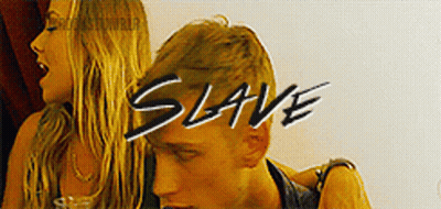 A Man And A Woman Are Standing Next To Each Other And The Word Slave Is On The Bottom GIF