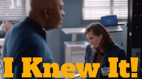 A Man And A Woman Are Standing Next To Each Other And The Words I Knew It Are Above Them GIF