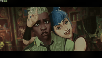 A Man And A Woman Are Standing Next To Each Other And The Words Vidhide Are On The Bottom GIF