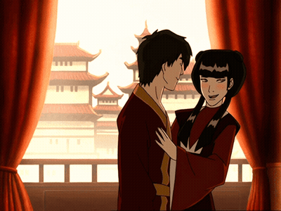 A Man And A Woman Are Standing Next To Each Other GIF