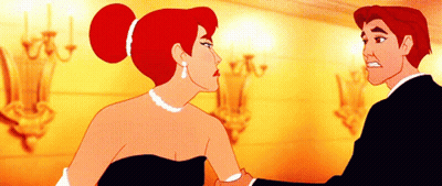 A Man And A Woman Are Standing Next To Each Other GIF