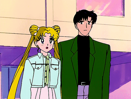 A Man And A Woman Are Standing Next To Each Other In A Cartoon GIF
