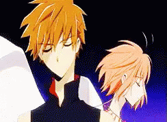 A Man And A Woman Are Standing Next To Each Other In A Cartoon . GIF