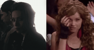 A Man And A Woman Are Standing Next To Each Other In A Dark Room And A Woman Is Crying . GIF