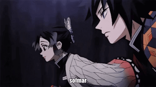 A Man And A Woman Are Standing Next To Each Other In A Dark Room And The Word Sofmar Is On The Bottom Of The Screen GIF