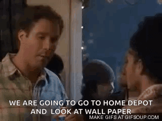 A Man And A Woman Are Standing Next To Each Other In A Room And Talking . GIF