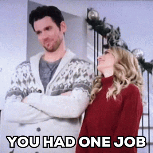 A Man And A Woman Are Standing Next To Each Other In A Room . GIF