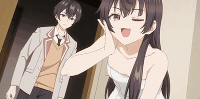 A Man And A Woman Are Standing Next To Each Other In A Room . GIF