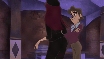 a man and a woman are standing next to each other in a room