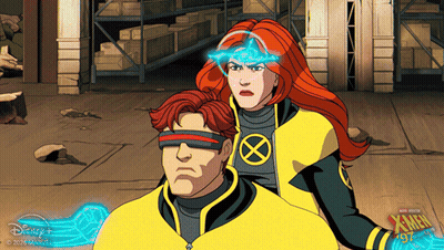 A Man And A Woman Are Standing Next To Each Other In A Scene From The X-Men Series GIF