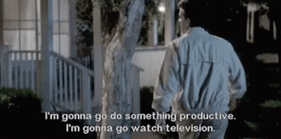 A Man And A Woman Are Standing Next To Each Other In Front Of A House . GIF