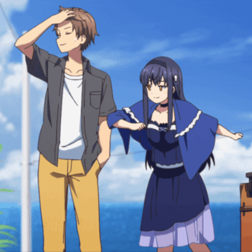 A Man And A Woman Are Standing Next To Each Other In Front Of The Ocean GIF