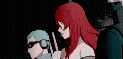 A Man And A Woman Are Standing Next To Each Other GIF