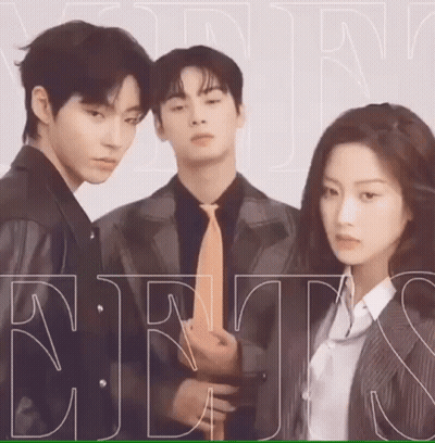 A Man And A Woman Are Standing Next To Each Other . The Man Is Wearing A Suit And Tie . GIF
