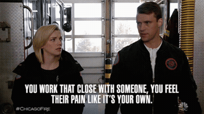 A Man And A Woman Are Standing Next To Each Other With A Caption That Says " You Work That Close With Someone " GIF