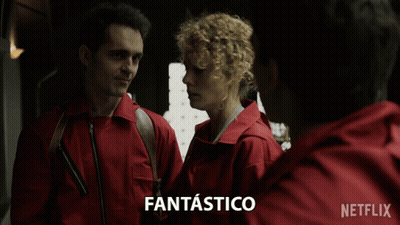 A Man And A Woman Are Standing Next To Each Other With Fantastico Written On The Bottom GIF