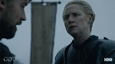 A Man And A Woman Are Standing Next To Each Other With The Word Got Written On The Bottom GIF