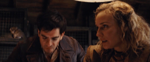 A Man And A Woman Are Standing Next To Each Other With The Words " F * Ck A Duck " Written In Yellow GIF