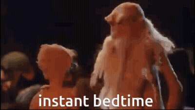 A Man And A Woman Are Standing Next To Each Other With The Words Instant Bedtime Written On The Screen . GIF