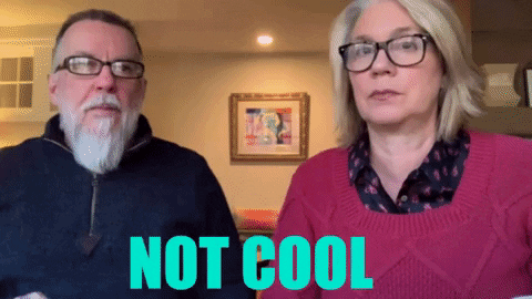 A Man And A Woman Are Standing Next To Each Other With The Words " Not Cool " On The Screen Behind Them GIF
